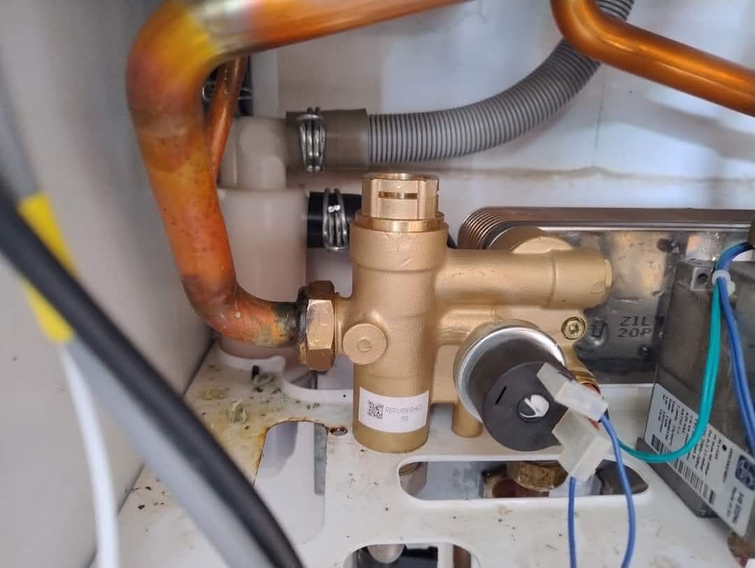 Close up of a boiler diverter valve replacement