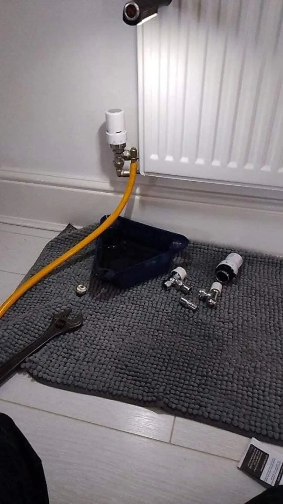 Radiator valves replaced with tools laid out